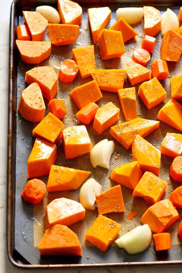 pieces of pumpkin, sweet potato and carrot on a baking tray