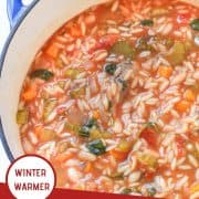 italian vegetable orzo soup in a blue rimmed dutch oven with a text overlay that reads "Italian Vegetable Orzo Soup - Winter Warmer"