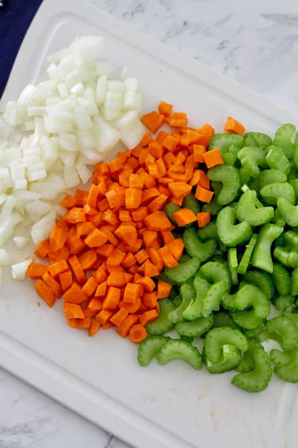 diced carrot, celery and onion on a chopping board