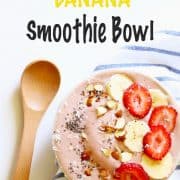 strawberry banana smoothie bowl with a wooden spoon