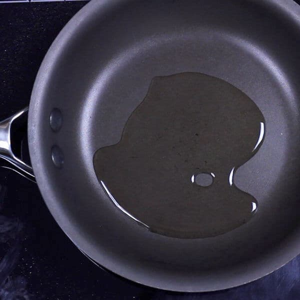 heating oil in a skillet pan