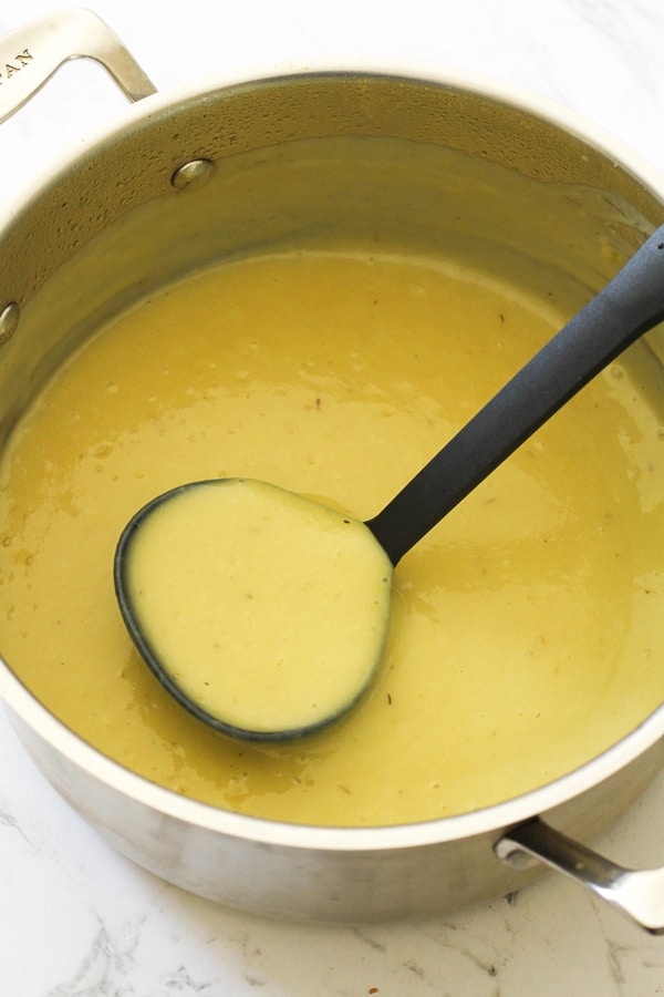 Pureed Potato and Leek Soup in a saucepan.