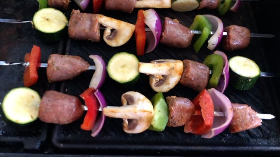 sausage and veggies skewers on the grill.