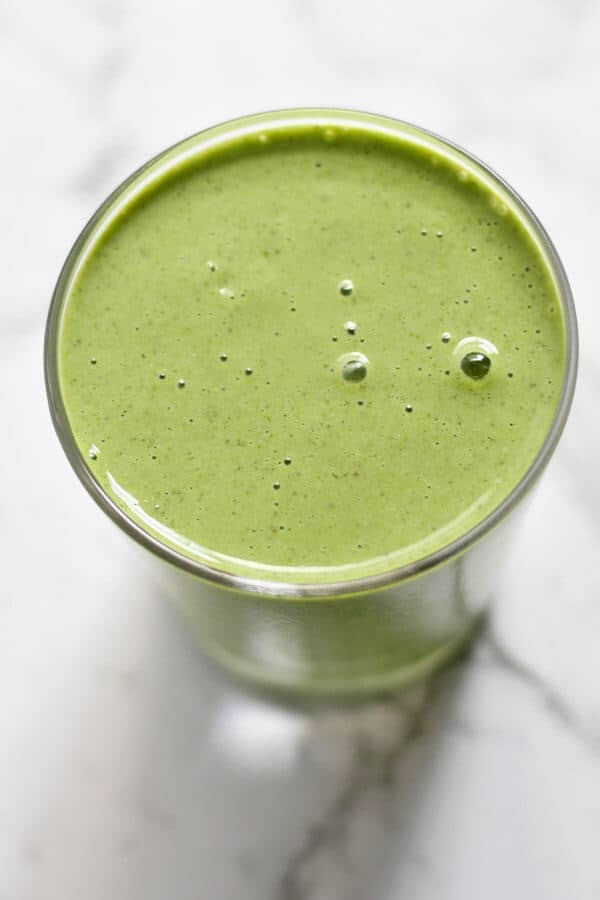 Kale Pineapple Smoothie in a small glass