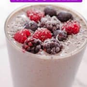 purple smoothie topped with berries with text overlay "mixed berry smoothie".