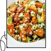 salad in a white bowl with text overlay "pumpkin & feta salad".