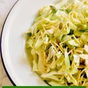 cabbage and crunchy noodle salad on a white plate
