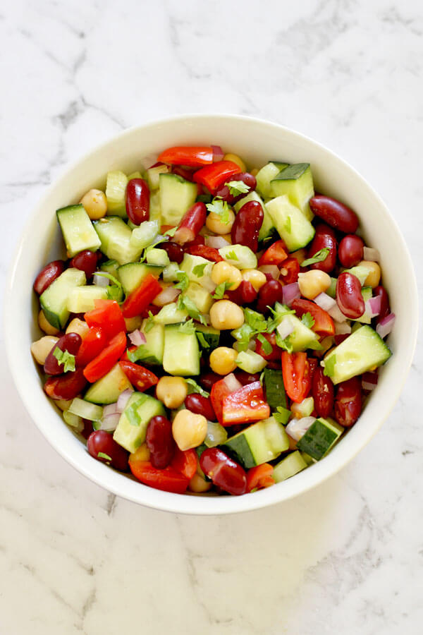 middle eastern bean salad in a white bowl