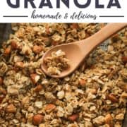 granola on a baking tray with text overlay "honey almond granola".