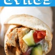 chicken gyros wrapped in parchment paper.