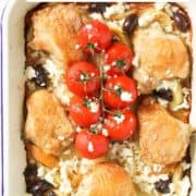 chicken thighs on top of a bed of roast potatoes with text overlay "sheet pan Greek chicken and potatoes".