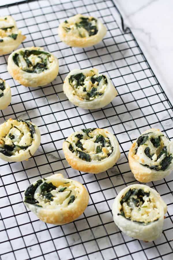 spinach & feta pinwheels on a cooling rack