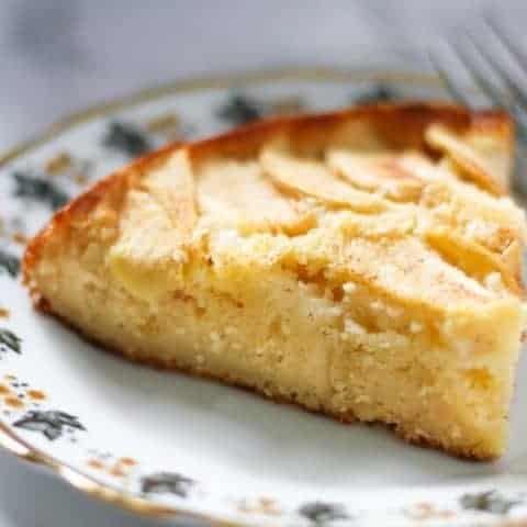 a slice of apple cake on a decorative plate.
