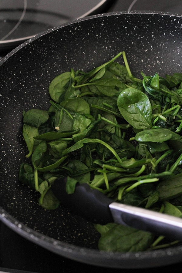 baby spinach in a wok. 