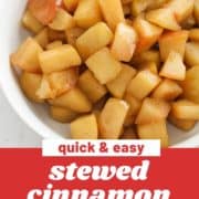 diced apple pieces in a bowl with text overlay "stewed cinnamon apples".