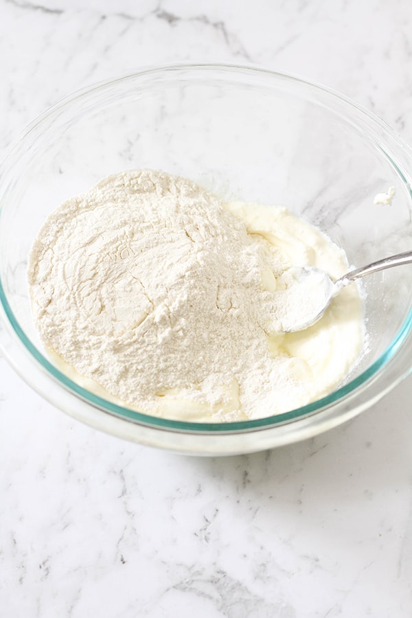 flour and yoghurt in a glass bowl.