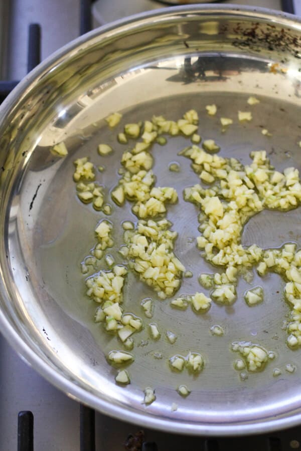 garlic sautéing in a frying pan. 