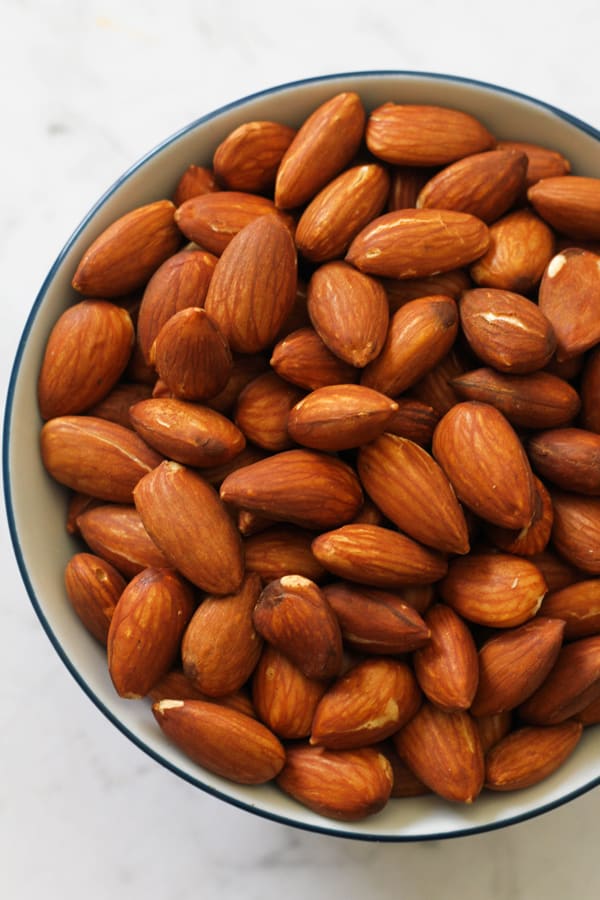 Dry roasted almonds in a small bowl.