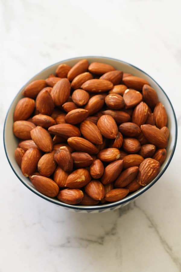 Dry roasted almonds in a small bowl. 