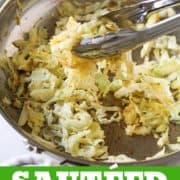 sauteed cabbage in a stainless steel frying pan.