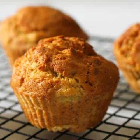 air fryer banana muffins on a wire cooling rack.