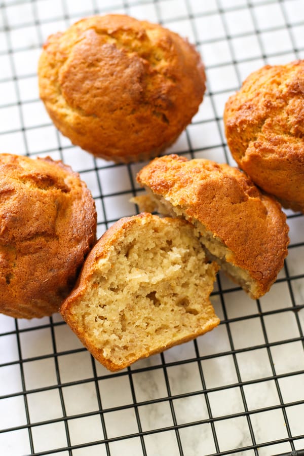 air fryer banana muffins on a wire cooling rack.