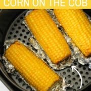 corn ears in an air fryer basket.