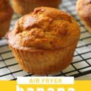 muffins on a wire rack with text overlay "air fryer banana muffins".