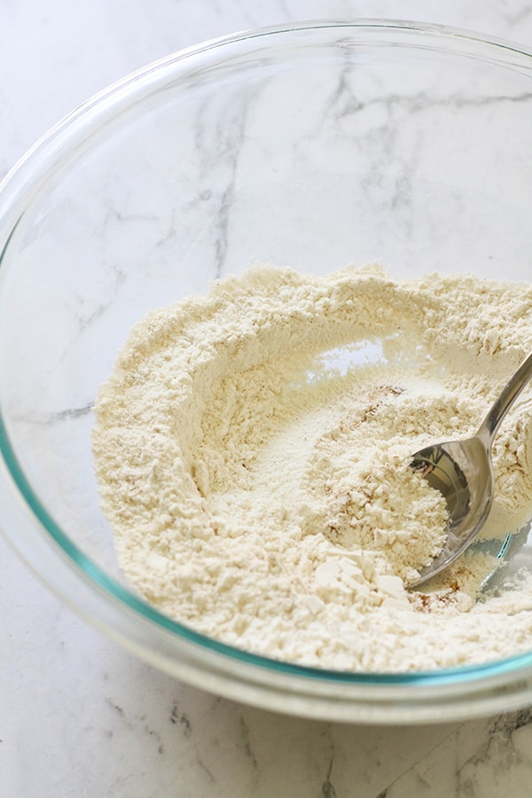 flour in a glass mixing bowl.
