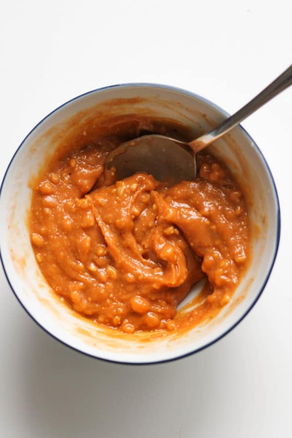 peanut hoisin sauce in a white bowl.