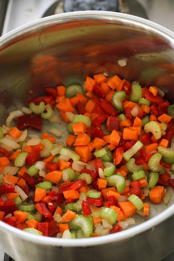 vegetables cooking in a large pot.