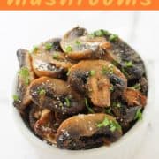 mushrooms in a white serving bowl with text overlay "air fryer mushrooms".