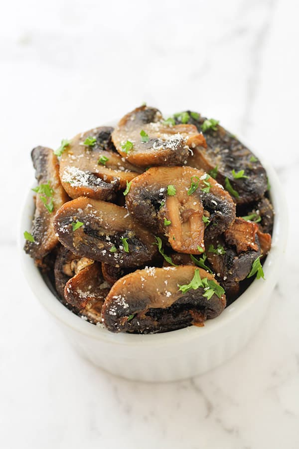 air fryer mushrooms in a white serving bowl.