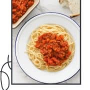 spaghetti and sauce on a white plate with text overlay "lentil bolognese".