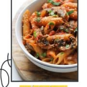 penne pasta in a white bowl with text overlay "tomato & mushroom pasta".
