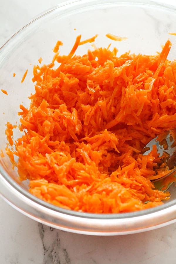 shredded carrots in a bowl.