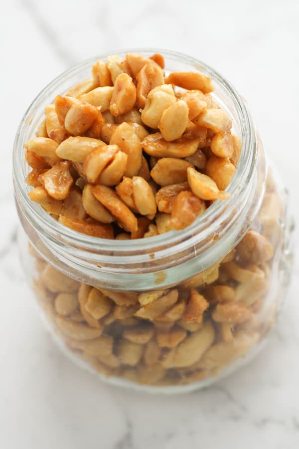 honey roasted peanuts in a glass jar.