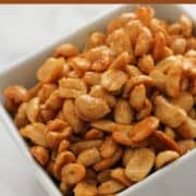 honey roasted peanuts in a white bowl.