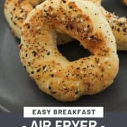 bagels on a grey plate with text overlay "easy breakfast - air fryer bagels".