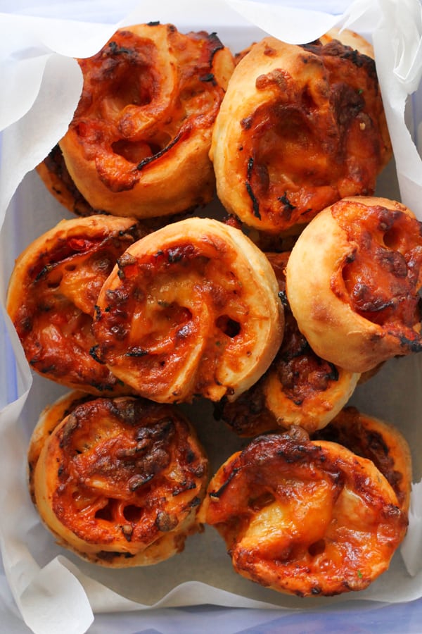 pizza pinwheels in a container.