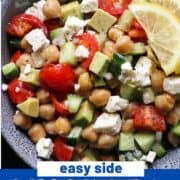 salad in a blue bowl with text overlay "chickpea, avocado & feta salad".