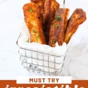 halloumi fries in a wire basket with text overlay "irresistible halloumi fries".