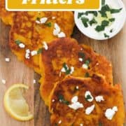 fritters laid on top of a wooden board with text overlay "pumpkin fritters".