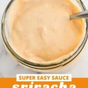 red sauce in a glass jar with a spoon stuck inside with text overlay "sriracha aioli".