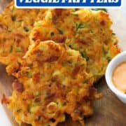 fritters on a wooden board with text overlay "meatless monday vegetable fritters".