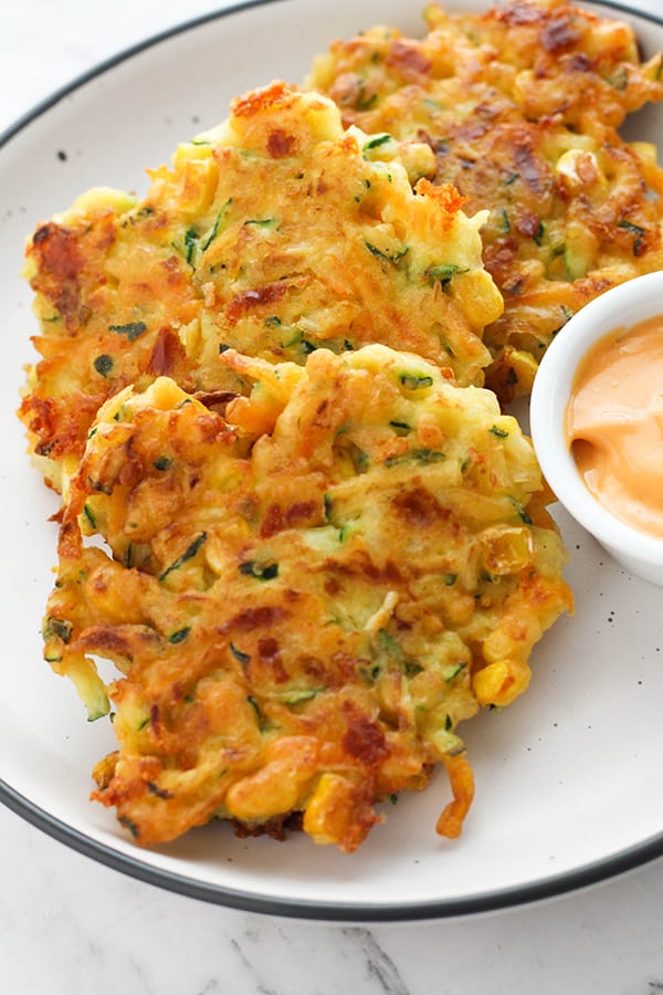 vegetable fritters on a white plate.