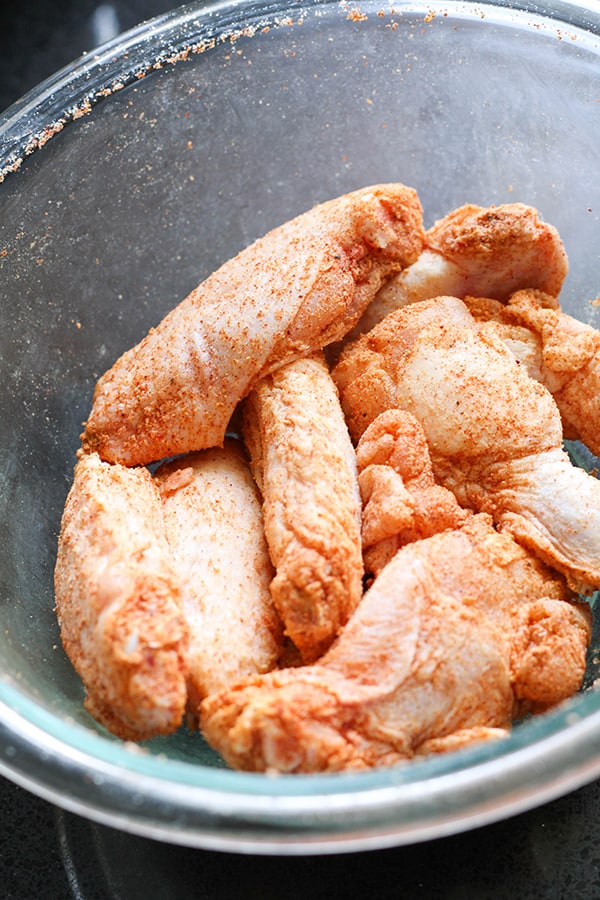 chicken wings in a glass bowl.
