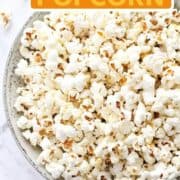 popcorn in a grey bowl with text overlay "sweet and salty popcorn".