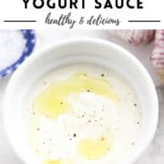 sauce in a white bowl with text overlay "creamy garlic yogurt sauce".