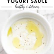sauce in a white bowl with text overlay "creamy garlic yogurt sauce".
